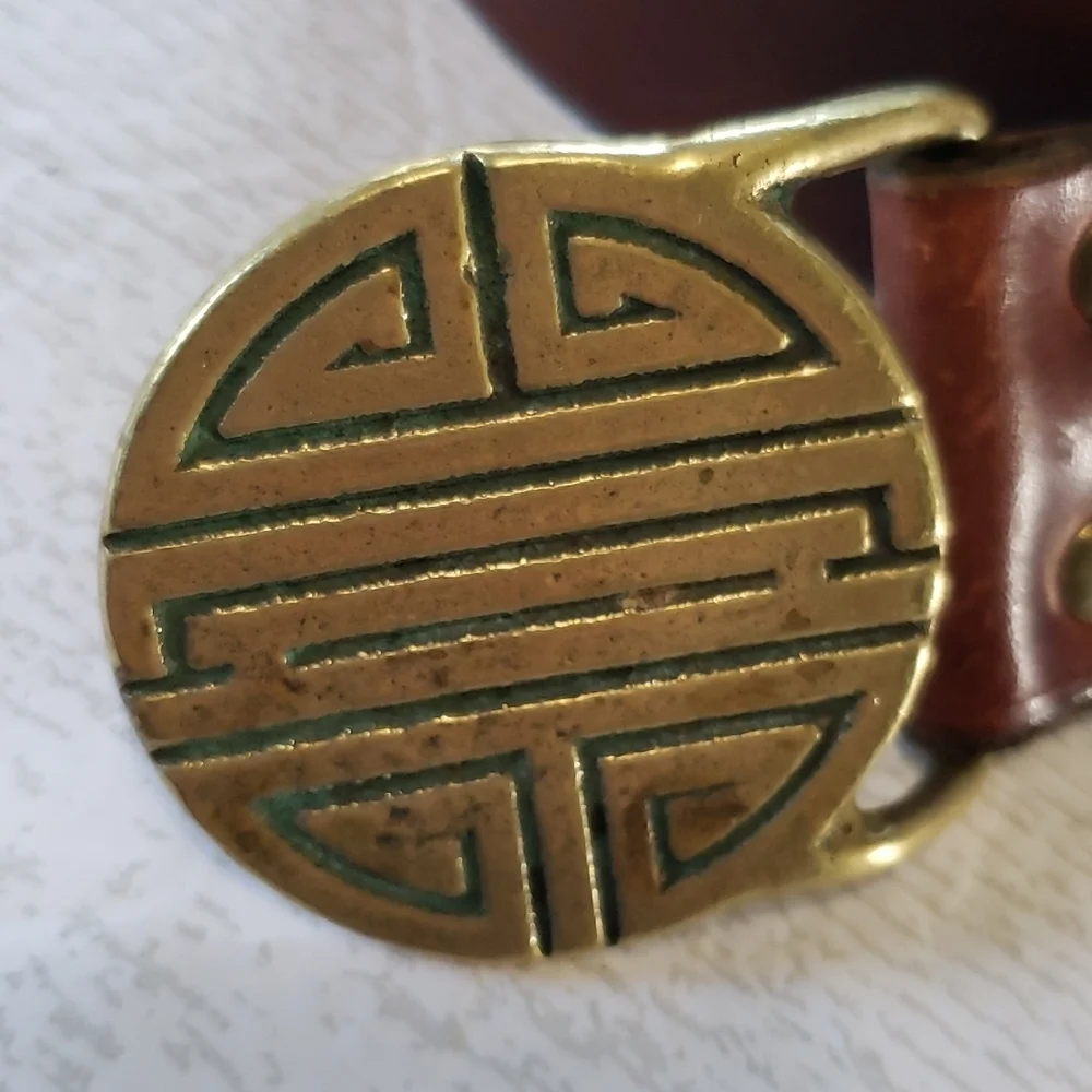 Compared to what brown leather strap with gold buckle